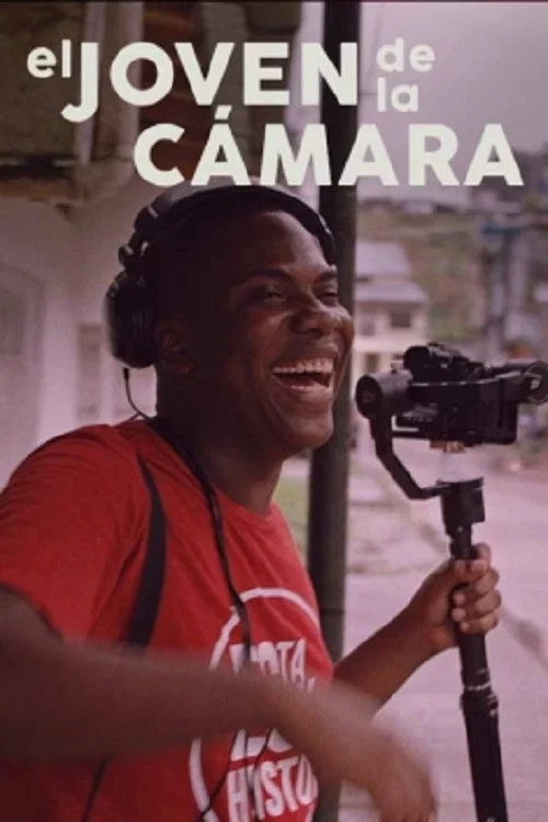 El joven de la cámara постер
